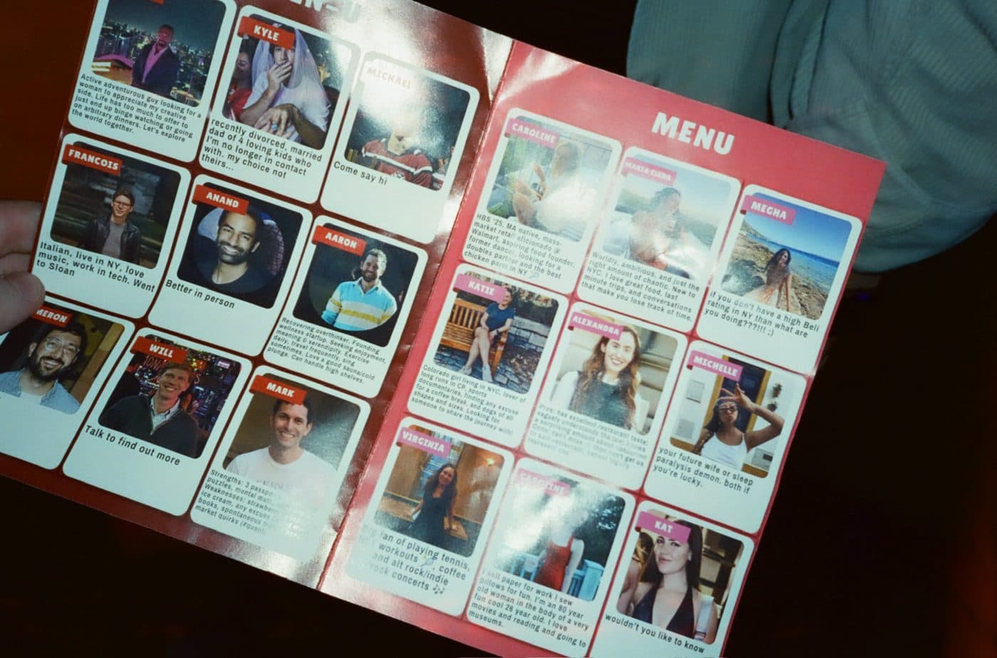 A guest holding the Meet Market menu