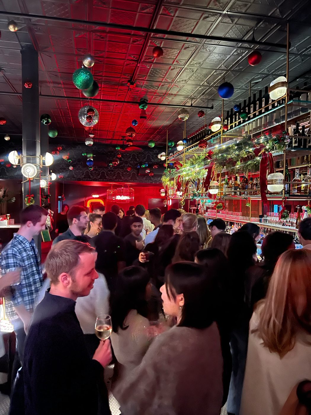 Guests mingling at a bar